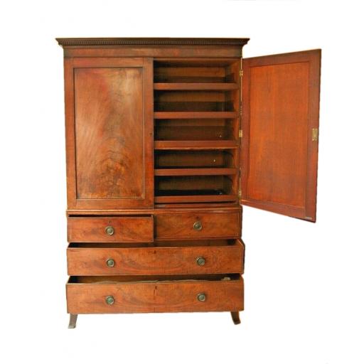 An early 19th century flame mahogany linen press / cupboard / drawers - SOLD