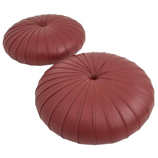 A Pair Of Pleated Maroon Leather Pouffes by Poltrona Frau