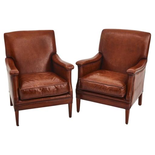 A Pair Of Tan Leather Club Chairs 'Bendic' With Studded Details